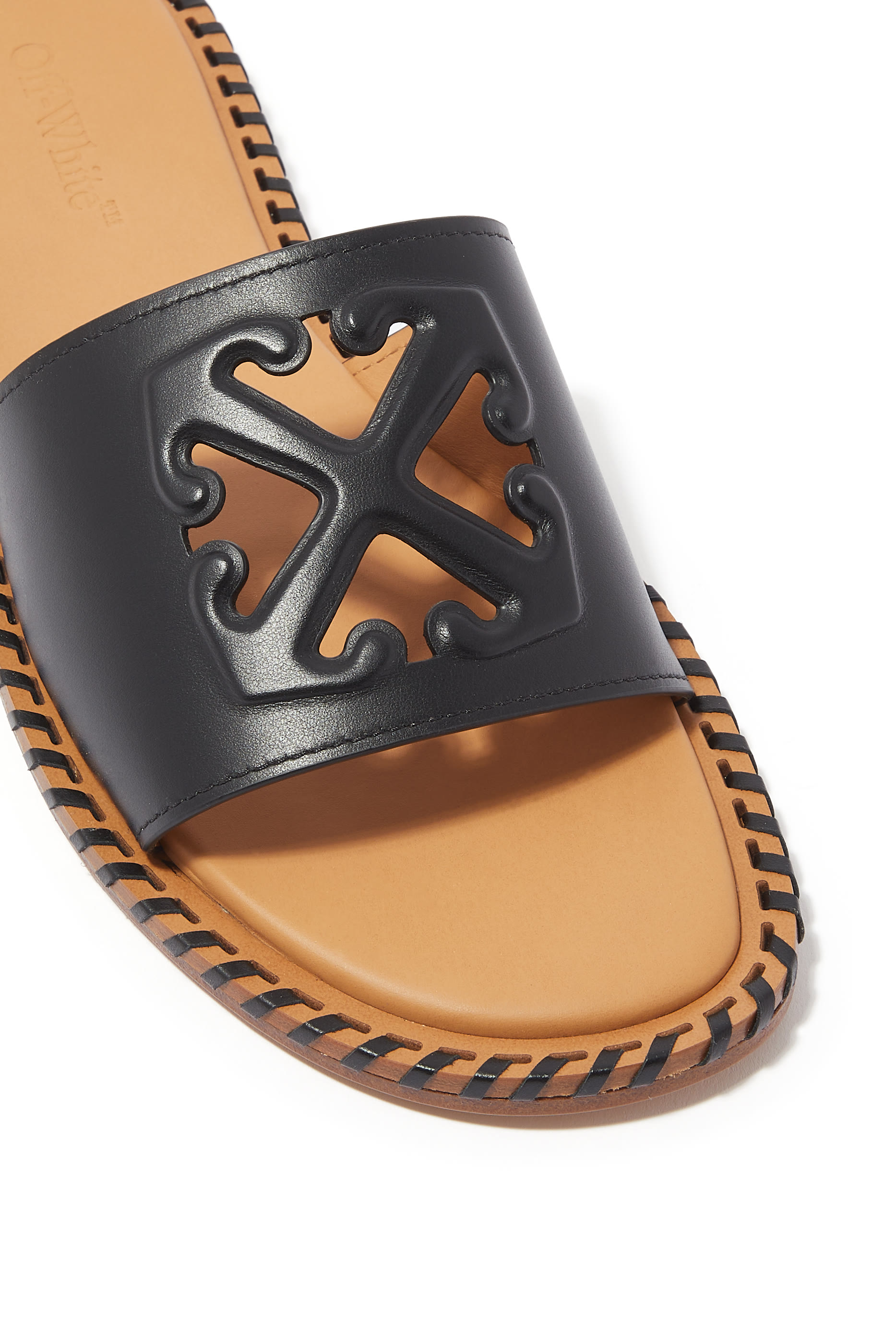 Twist Embossed Arrow Leather Slides